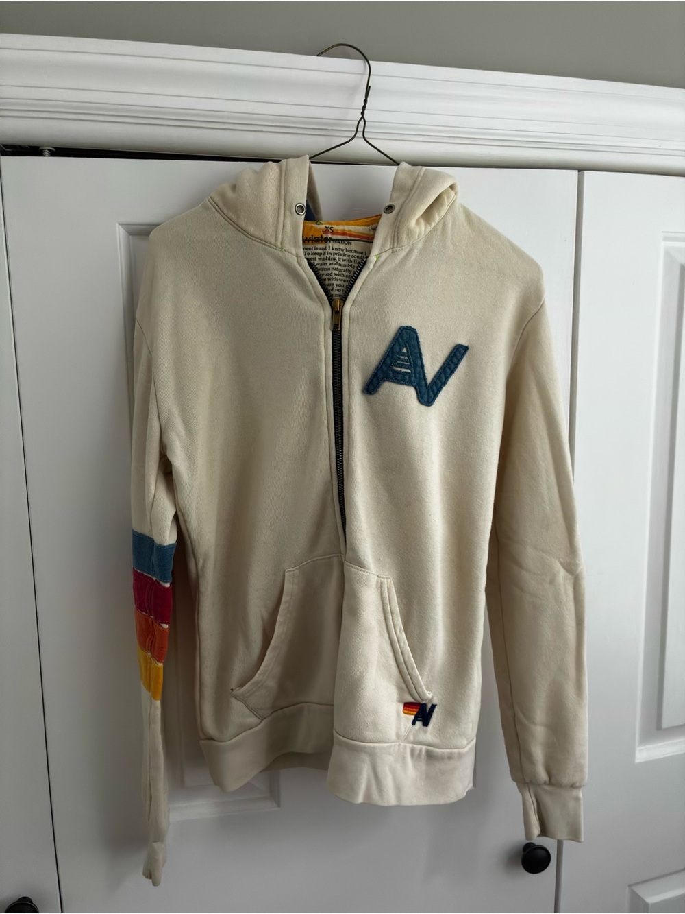 Aviator Nation Cream Hoodie with Yellow and Orange Trim and rainbow hood.